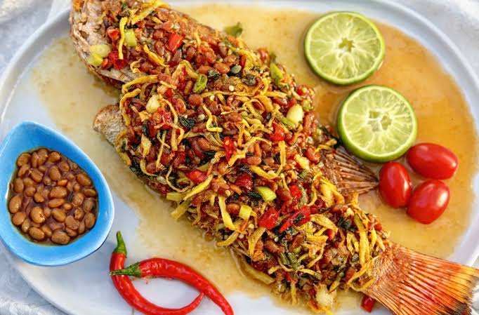 Crispy battered Fish Served with Cooked Vegetables & Ginger sauce